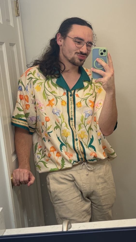 mirror selfie with floral shirt and khaki pants