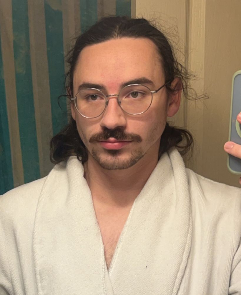 me with a bright red spot between my eyebrows bc i just plucked between them bitches—also i’m wearing a white robe which Vs to the upper middle of my chest