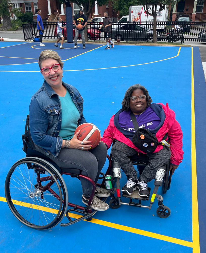 Ariel, sitting in a wheelchair, with her friend Sally, who is in her wheelchair 