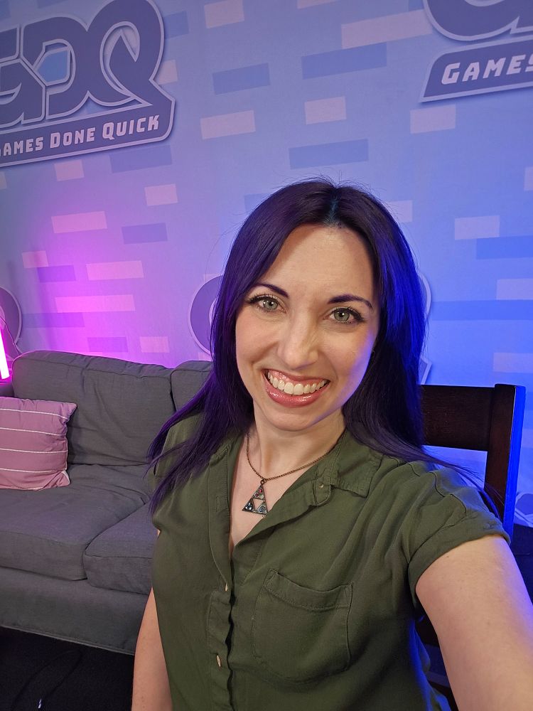 Photo of Jaidlyn in front of the games done quick background