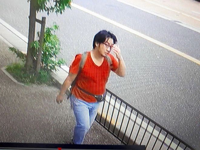 Shinji Aoba walking down the street