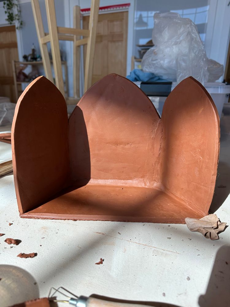 Three pane altar made from red clay