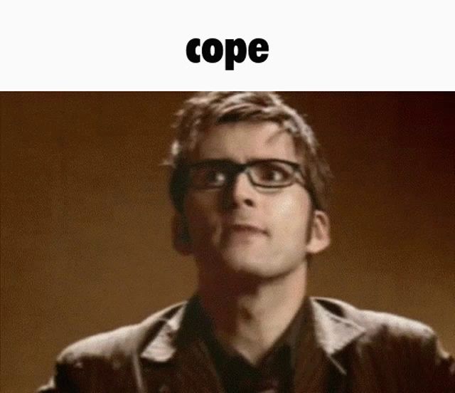 a man wearing glasses and a jacket is looking up at the word cope