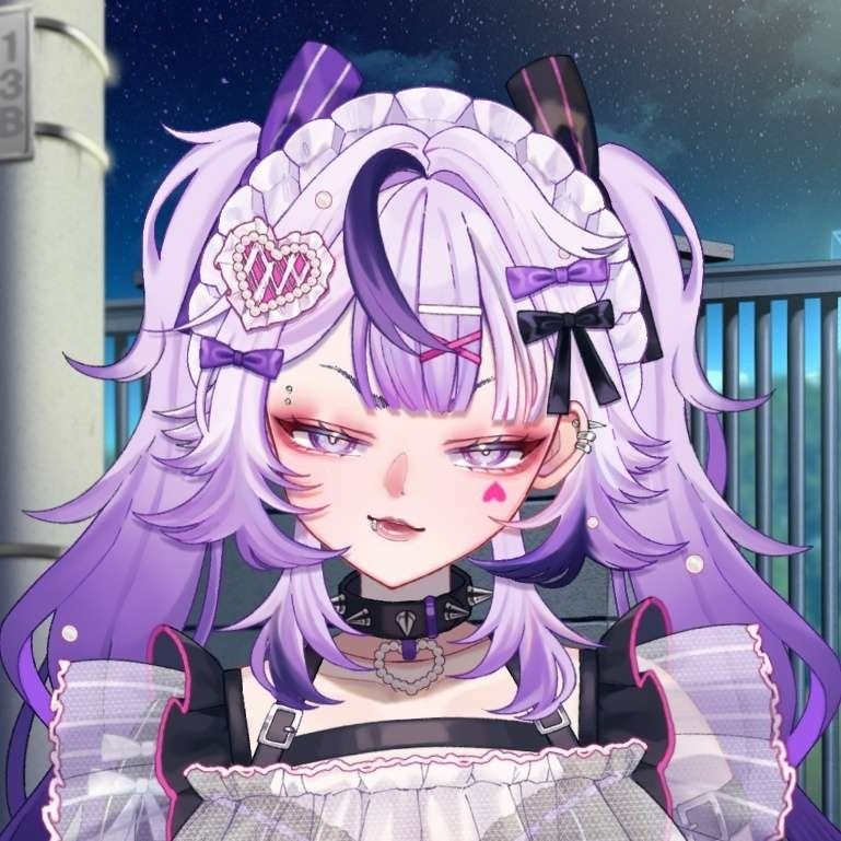 Crow dolly's vtuber model. She is smirking at you in a sassy manner. She has purple pigtails, and an upside down heart under her left eye♡ she is covered in piercings and an oberabundance of hair excessories. On her neck is a spiked collar with a heart made of pearls dangling from it's center.