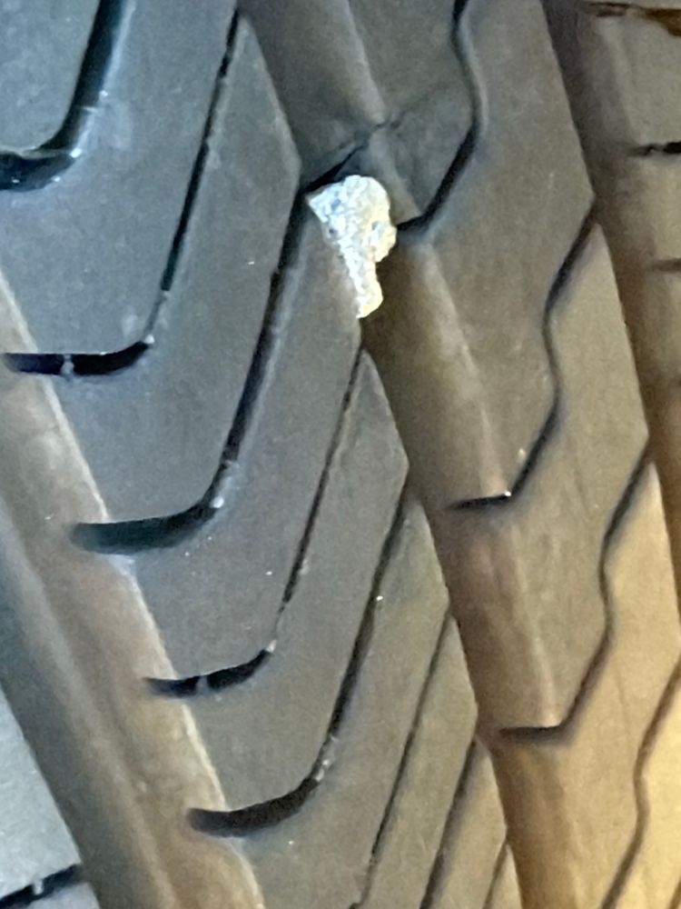 The culprit. Is it a nail? No clue. But it is a decent chunk of metal. Thanks, Houston.