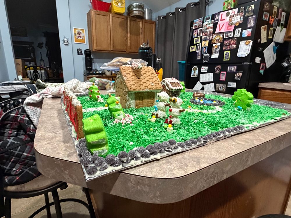 Side view of their cottage. Now they’re snowmen! And there’s ducks gorging themselves on peas!