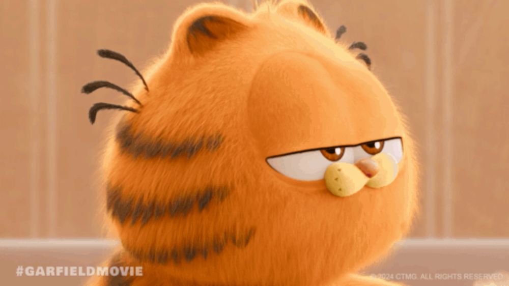 a close up of garfield from the garfield movie with a yellow nose