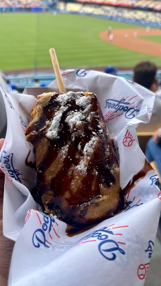 A deep fried cheesecake served at Dodger Stadium in Los Angeles. It’s topped with powdered sugar and a drizzle of chocolate syrup.