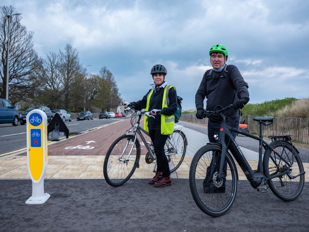 Two colleagues cycling on the National Cycle Network Route 1 in Broughty Ferry.