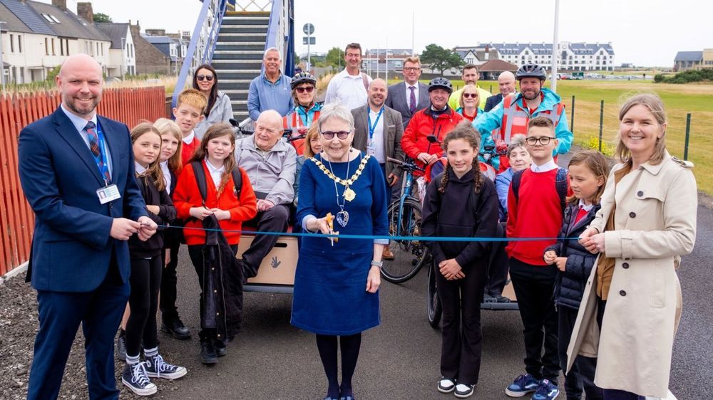 Project partners and local people gather to cut the ribbon at the opening of National Cycle Network improvements in Carnoustie.
