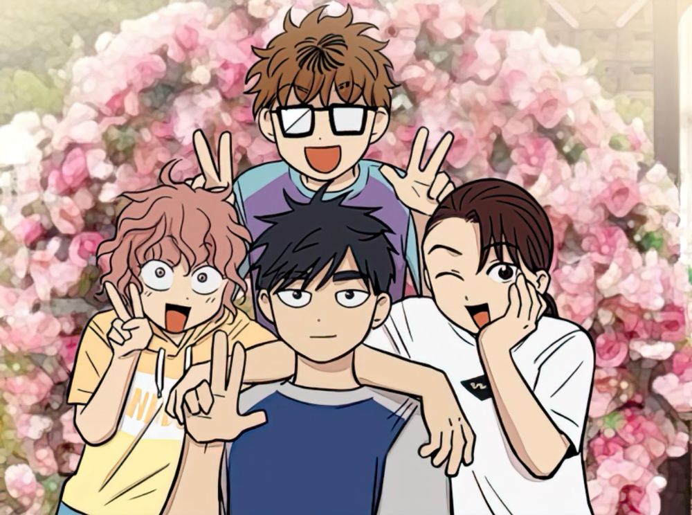 Juwan, Marie, Haejoon and Hara pose for a picture together. Juwan has both hands held up with peace signs, while Marie has one hand in a peace sign as her other arm rests on Haejoon’s shoulder. Hara also has one arm resting on Haejoon’s shoulder, and cups her cheek with her other hand while winking