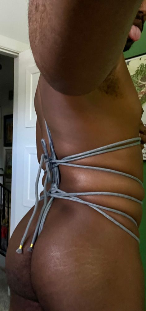 a selfie of the back of me, nude, wrapped in gray rope tied in a western style hishi tie