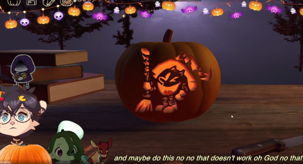 4 people pto the right hand side, a pumpkin in the middle featuring A witchy pac man on a wooden table