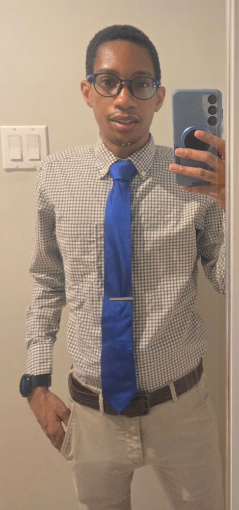 Mirror selfie in button-down, tie, and khakis