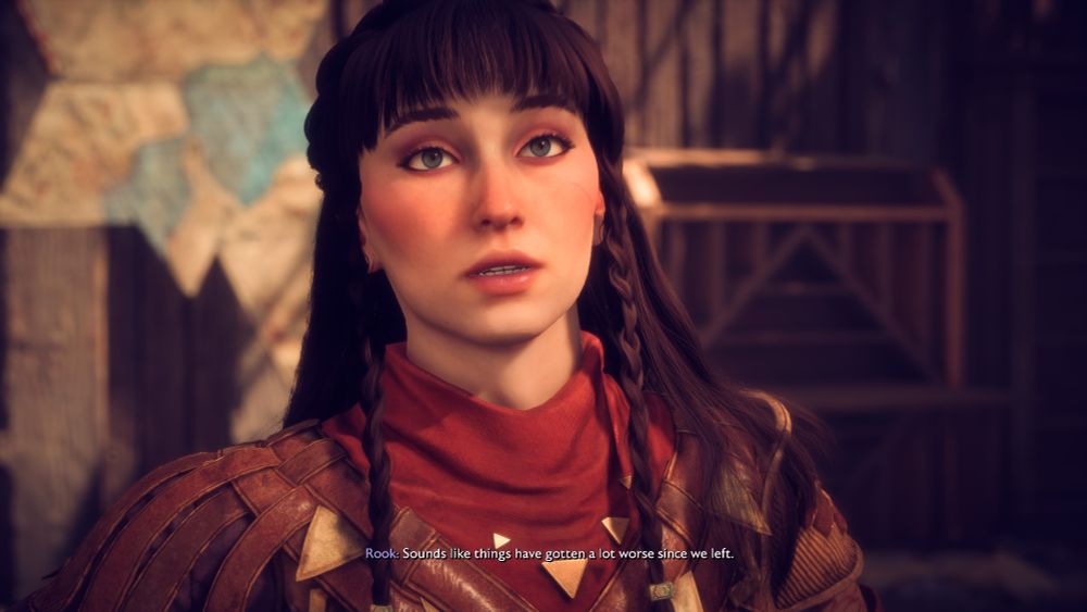 A screenshot of a pale female human Rook with dark brown hair and blue eyes. She's got bangs and accent braids.