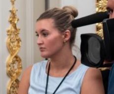 Forlorn woman looks on as Trump enters one of his White House gold spray paint rooms.