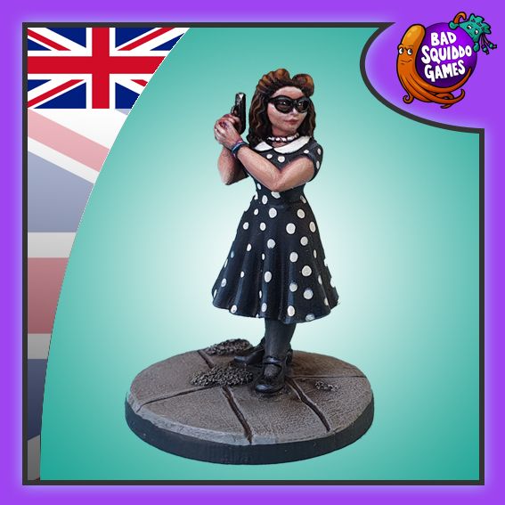 Secret Agent Annie with a polka dot dress, pistol, and 40's hairstyle.