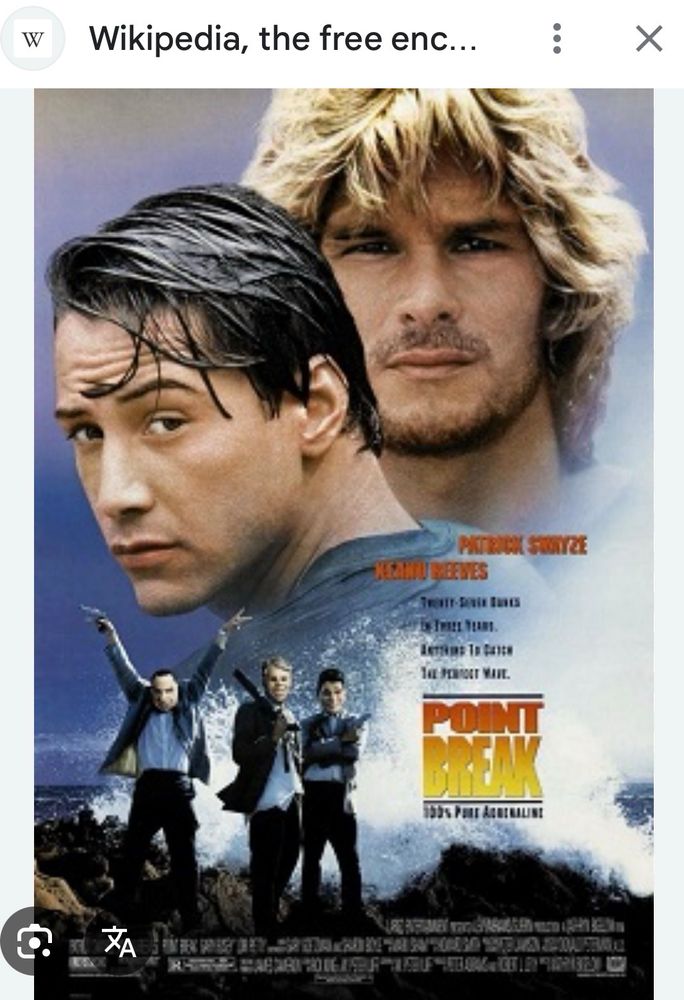 A photo of the movie poster of Point Break with Keanu, Reeves, Patrick Swayze and Gary Busey, 1991