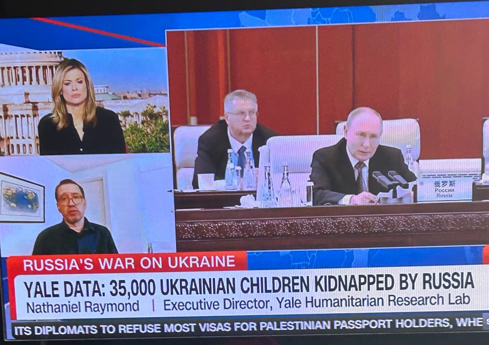 Screenshot from CNN with a photo of Putin. Yale data 35,000 Ukrainian children have been kidnapped by Russia.