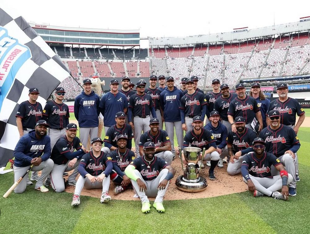 a group picture of the atlanta braves with the  speedway classic trophy 