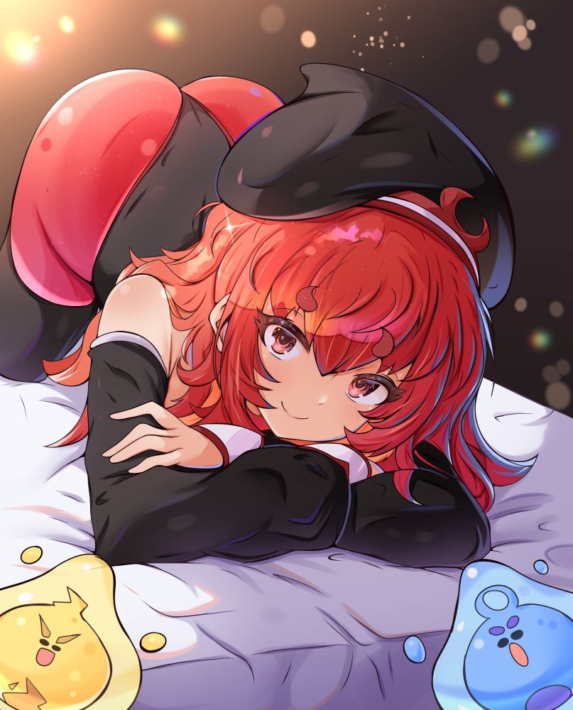 Ember laying on the bed with Lite and Penny in their slime forms