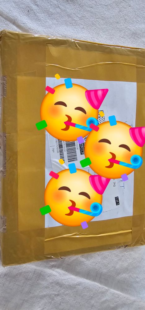 Secret Santa Parcel with emotional faces covering the address label
