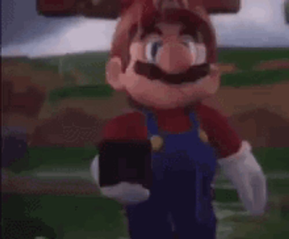 mario is holding a cell phone in his mouth .