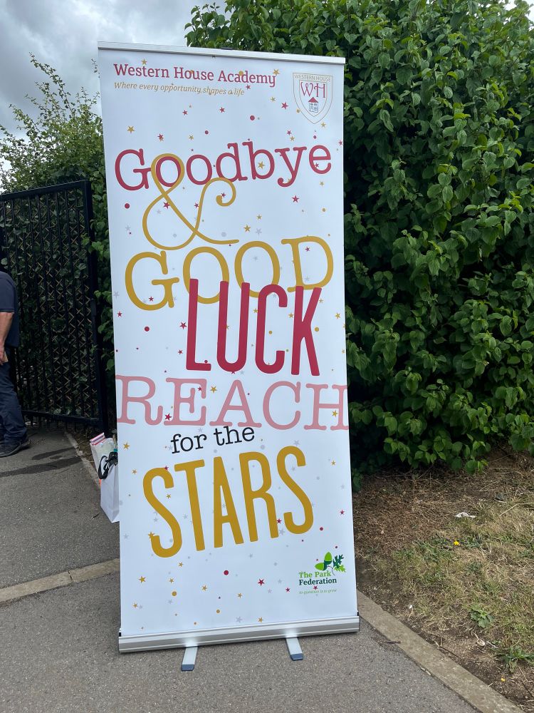 Goodbye and good luck, reach for the stars banner. Always used at the gate to wish our year 6s goodbye. 