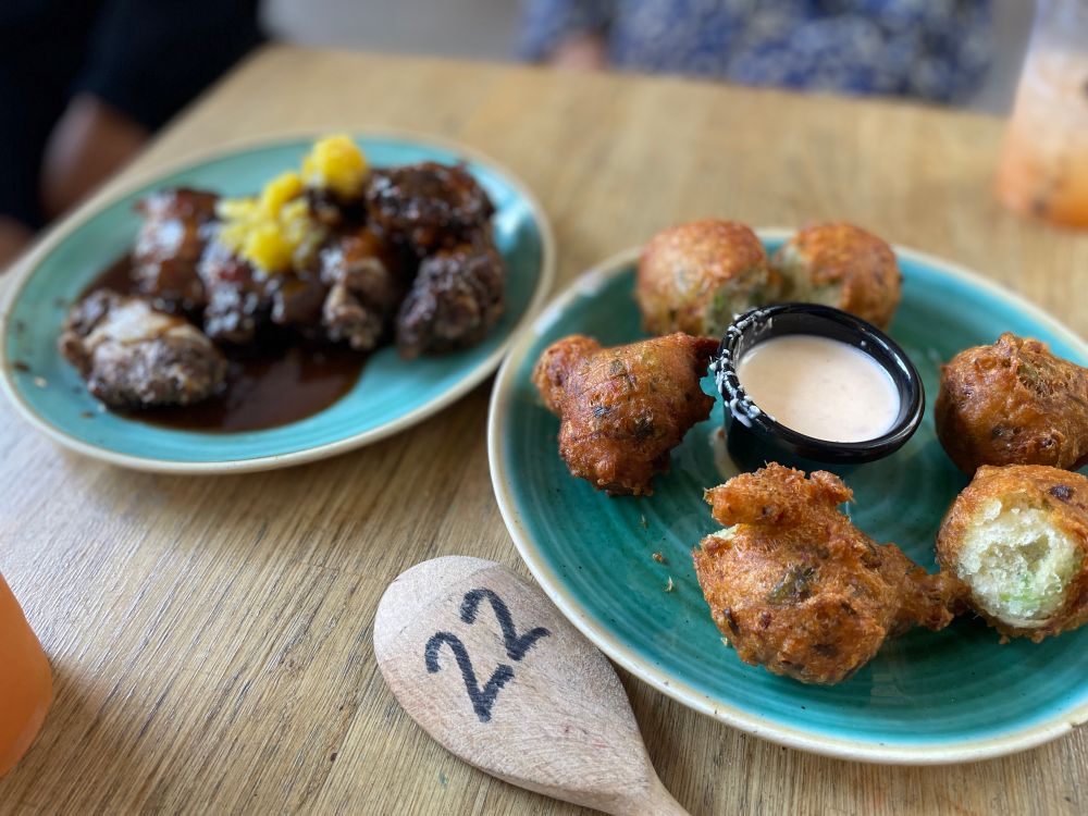 Jerk chicken wings and cod fritters with lime and chilli aioli
