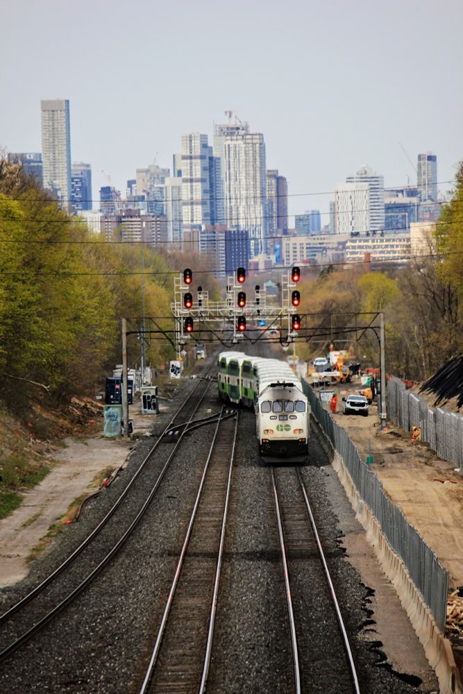 A train changes tracks as it heads towards the city.