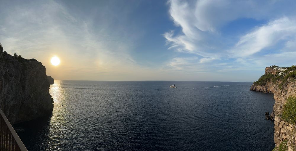 Panoramic photo of a sunset on the Mediterranean from a hill above Port De Soller, Mallorca, Spain.