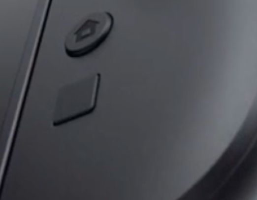 A close up of the right Joy-con for the Nintendo Switch 2, showing the home button and an unmarked button underneath.