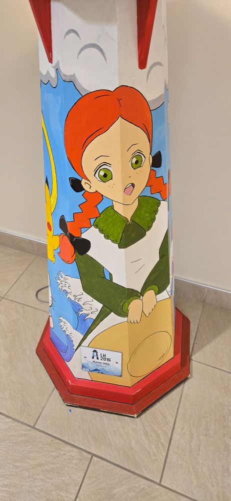 A painted lighthouse, the civic art project of Charlottetown. It has Anne of Green Gables, Pikachu, Goku, Hello Kitty, and Sailor Moon 