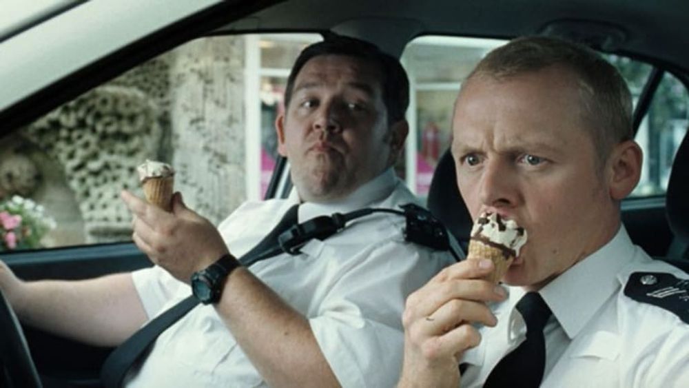 Nick Frost and Simon Pegg eating cornettos in a police car in Hot Fuzz 