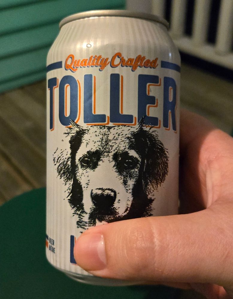 A can of beer with a dog on it 