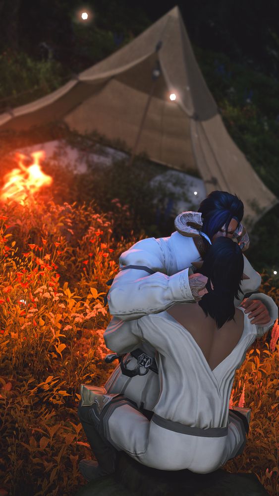 A shot of Lunais and Ruan by a tent with a campfire, somewhere in the Shroud. Both men are dressed down from their usual armor. Lunais is seated on a tree stump, arms around Ruan's middle. Ruan is leaning in, one hand at the back of Lunais' neck, and gently kissing him on the forehead.