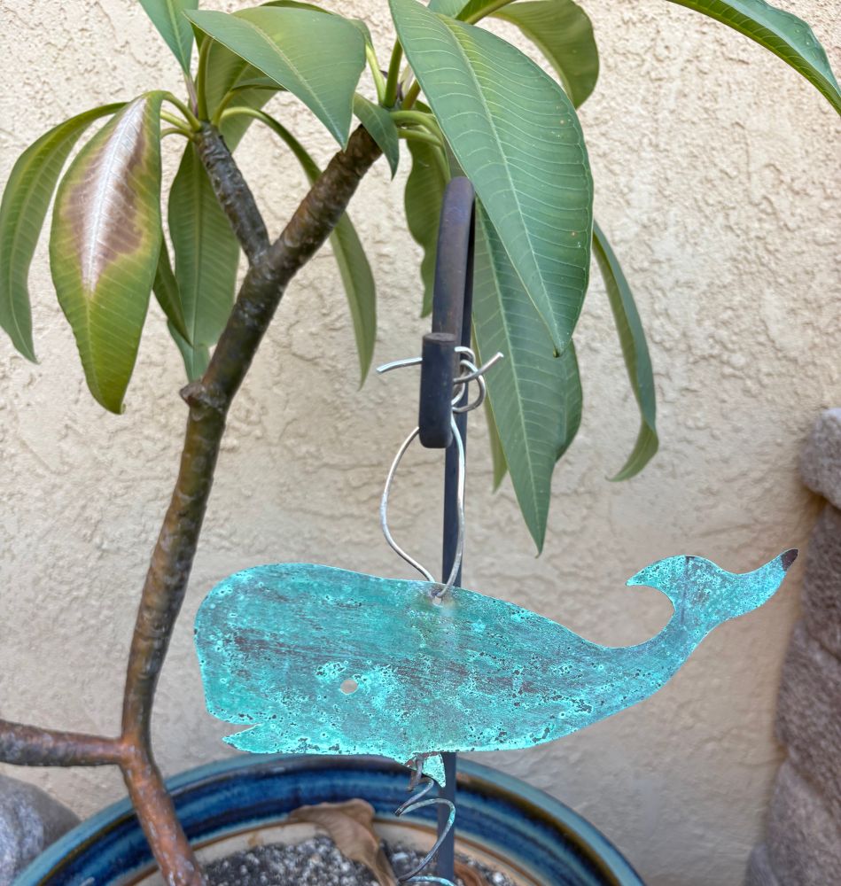 Plumeria with a hanging blue whale ornament 