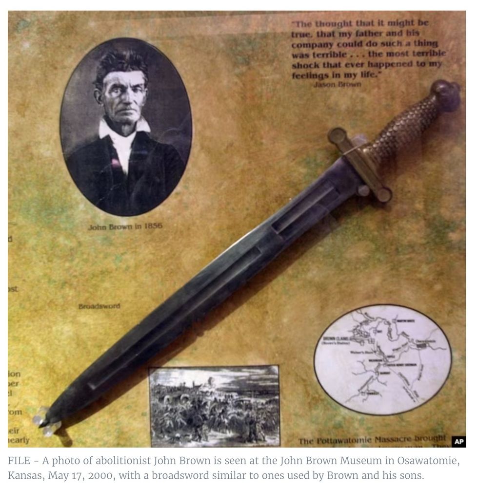 A photo of abolitionist John Brown is seen at the John Brown Museum in Osawatomie, Kansas, with a broadsword similar to ones used by Brown and his sons.
