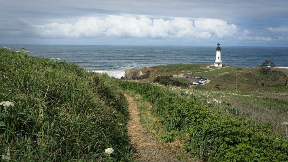 Yaquina Head Lighthouse in Newport, Oregon with a interesting cloud formation behind it.