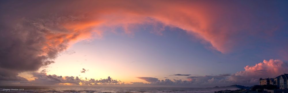 A multi shot panorama of an autumn sunset from Nye Beach, Newport, Oregon.