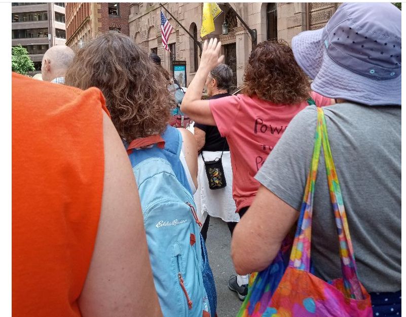 Labor Day 9.1.25 Boston, MA Our march finally began through the streets of downtown Boston. Picture of some of our marchers with a small part of the city skyline in the background.
