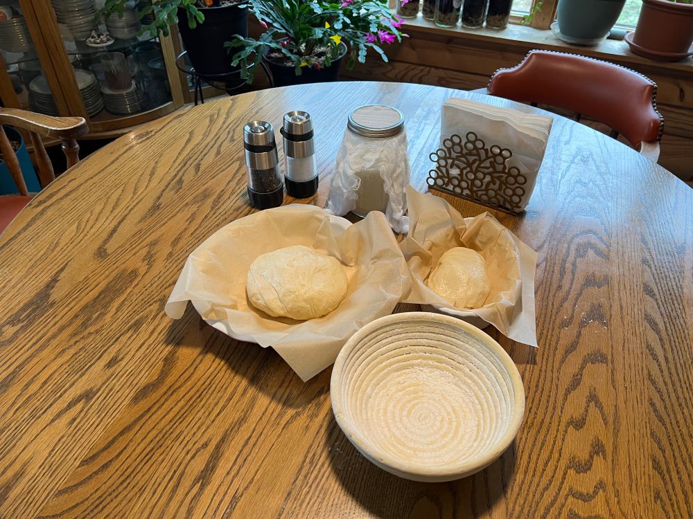 Sourdough pre second rise with bread form and starter jar