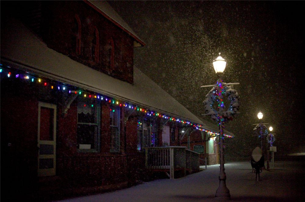 Wreaths on street lamps in a blizzard 