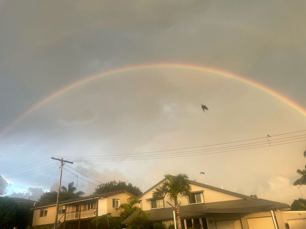 Rainbow over houses