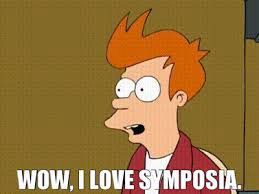 Fry of futurama with the words “Wow, I love symposia” at the bottom. A screenshot and quote from an episode,