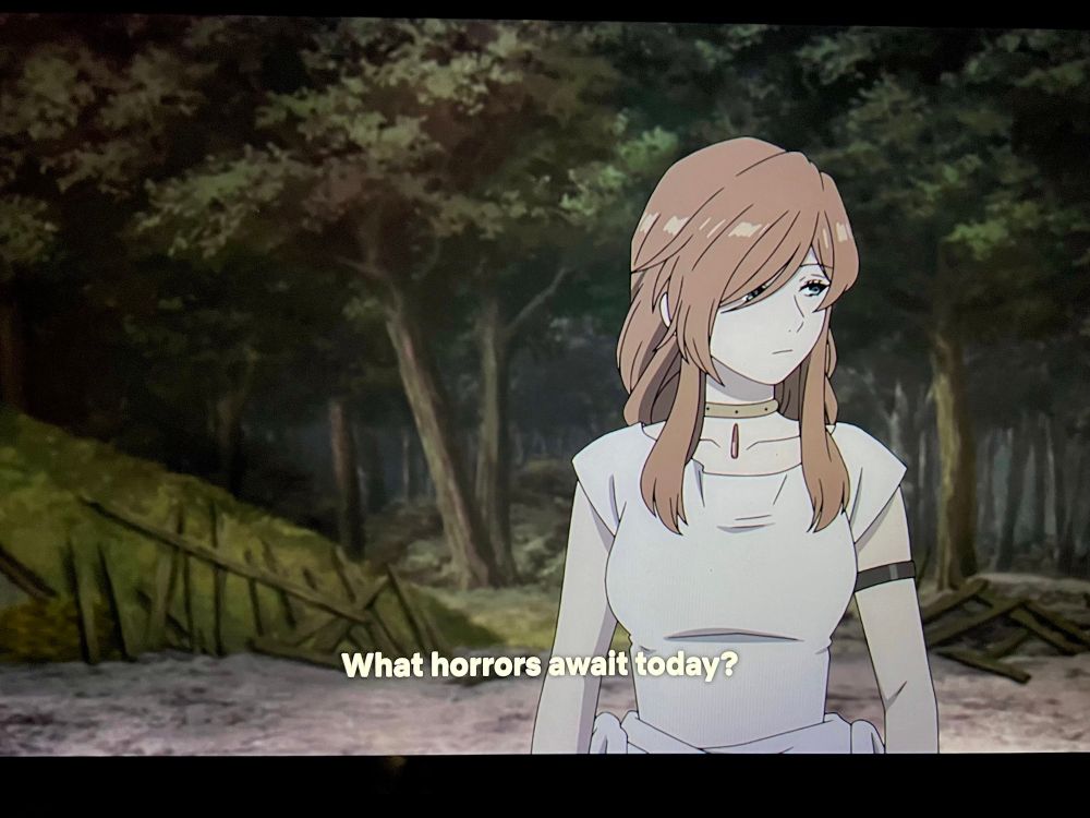 Screenshot from Frieren. Flamme a powerful woman mage is looking around a destroyed town. The subtitle says “what horrors await today?”