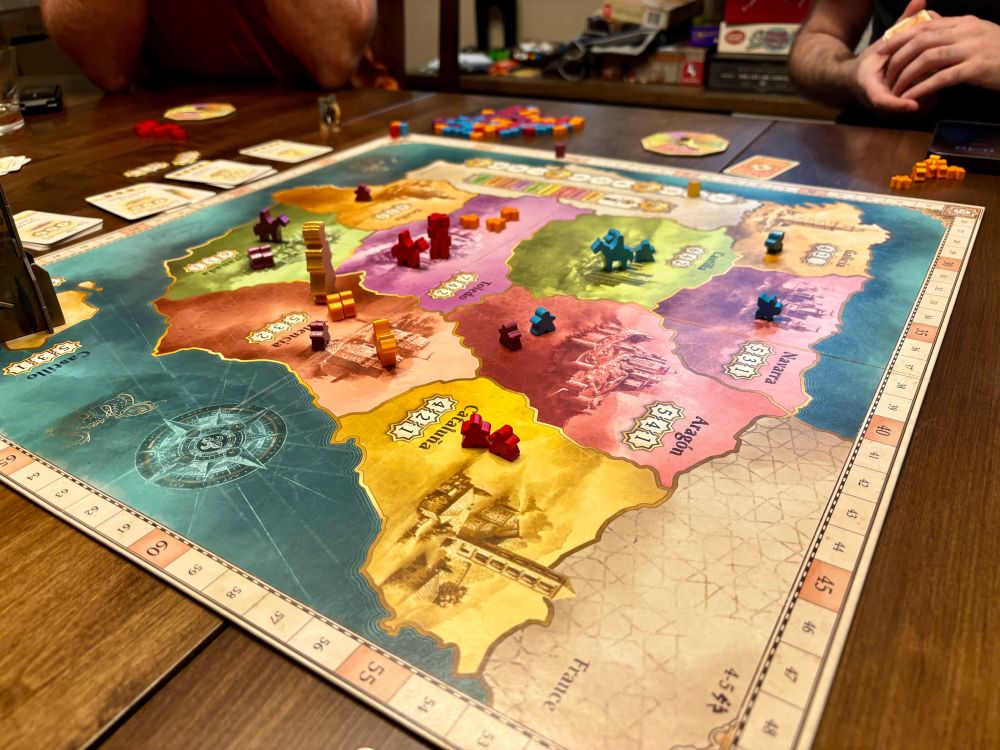 A Boardgames with a multicolor map of Spain covered with colored tokens