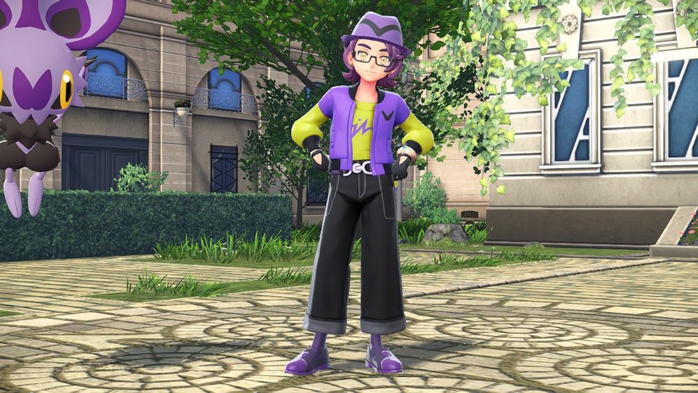 Player character from Pokemon Legends: Z-A wearing a purple trilby, black rectangular glasses, yellow earring studs, a yellow & purple blouson over a yellow shirt with a purple squiggly line on the front, black 3-fingered gloves, black denim wide-leg pants, purple socks, and purple pointed loafers. He is standing next to Hotel Z with his hands on his hips. There is an alpha Noibat in the upper left corner of the frame. ... You really can't keep your eyes off it, huh? No, you can't have the Noibat, IT'S MINE! Get your own alpha Noibat!