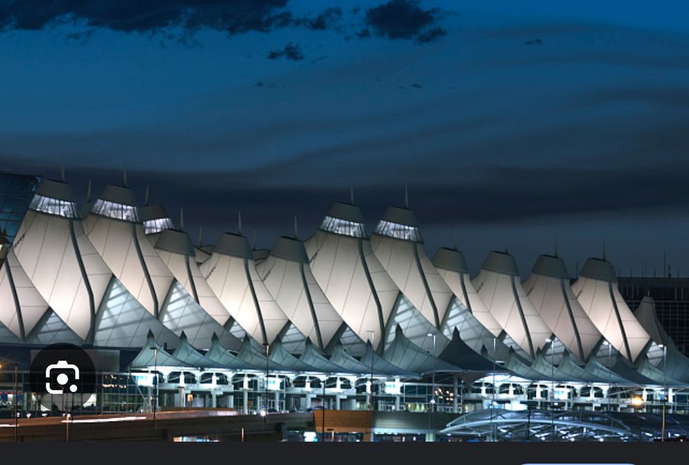Picture of Denver Airport white roof profile - They couldn’t bring they airport to the mountains, so the made the airport look like mountains.