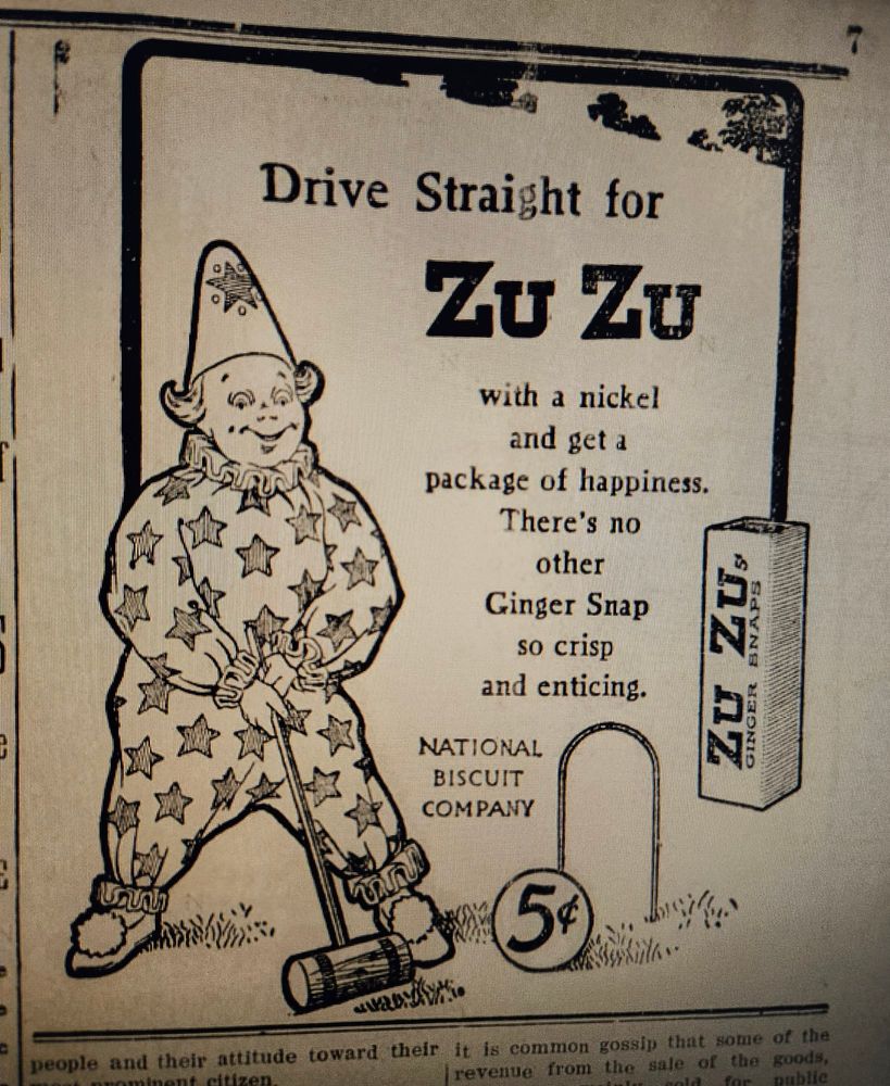 Black and white newspaper ad showing a clown playing croquet. Ad is for zuzu Biscuits